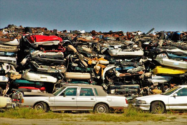 Stacked salvage cars awaiting dismantling